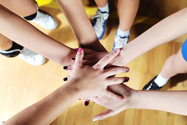 volleyball game sport with group of girls indoor in sport arena